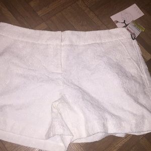 Cute lace shorts with floral design.